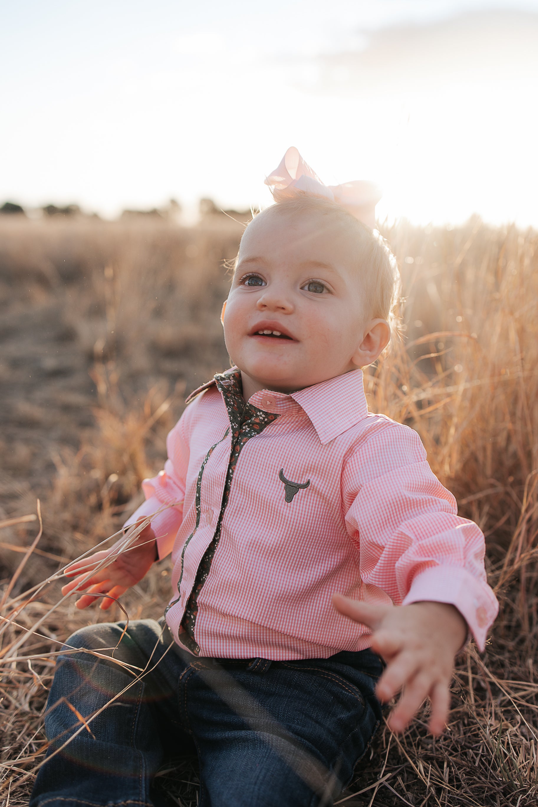 Chloe coral gingham long sleeve romper worn by toddler showing adorable coral gingham country style