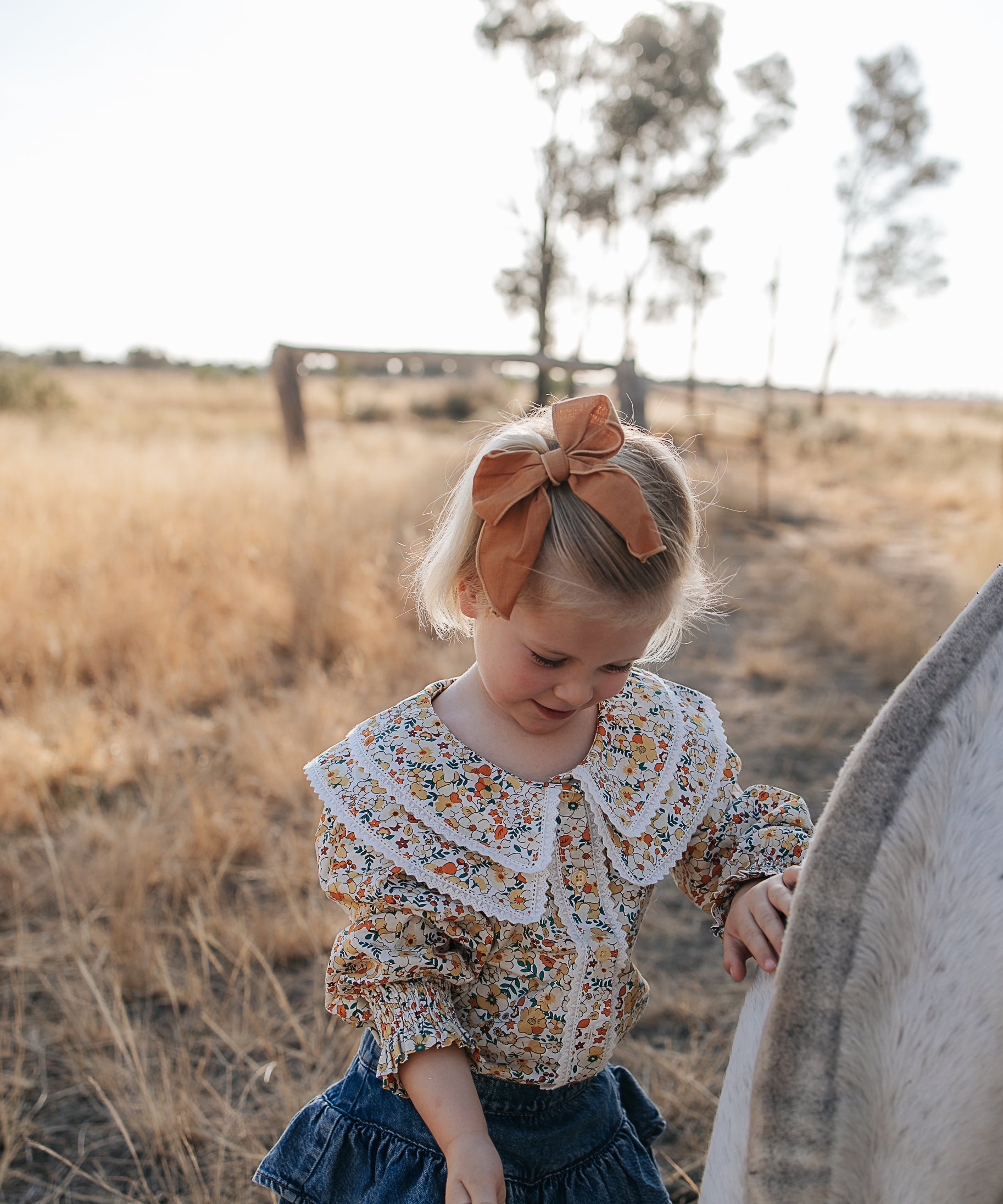 Elsie girls butter yellow floral long sleeve blouse worn by girl showing charming yellow floral country style