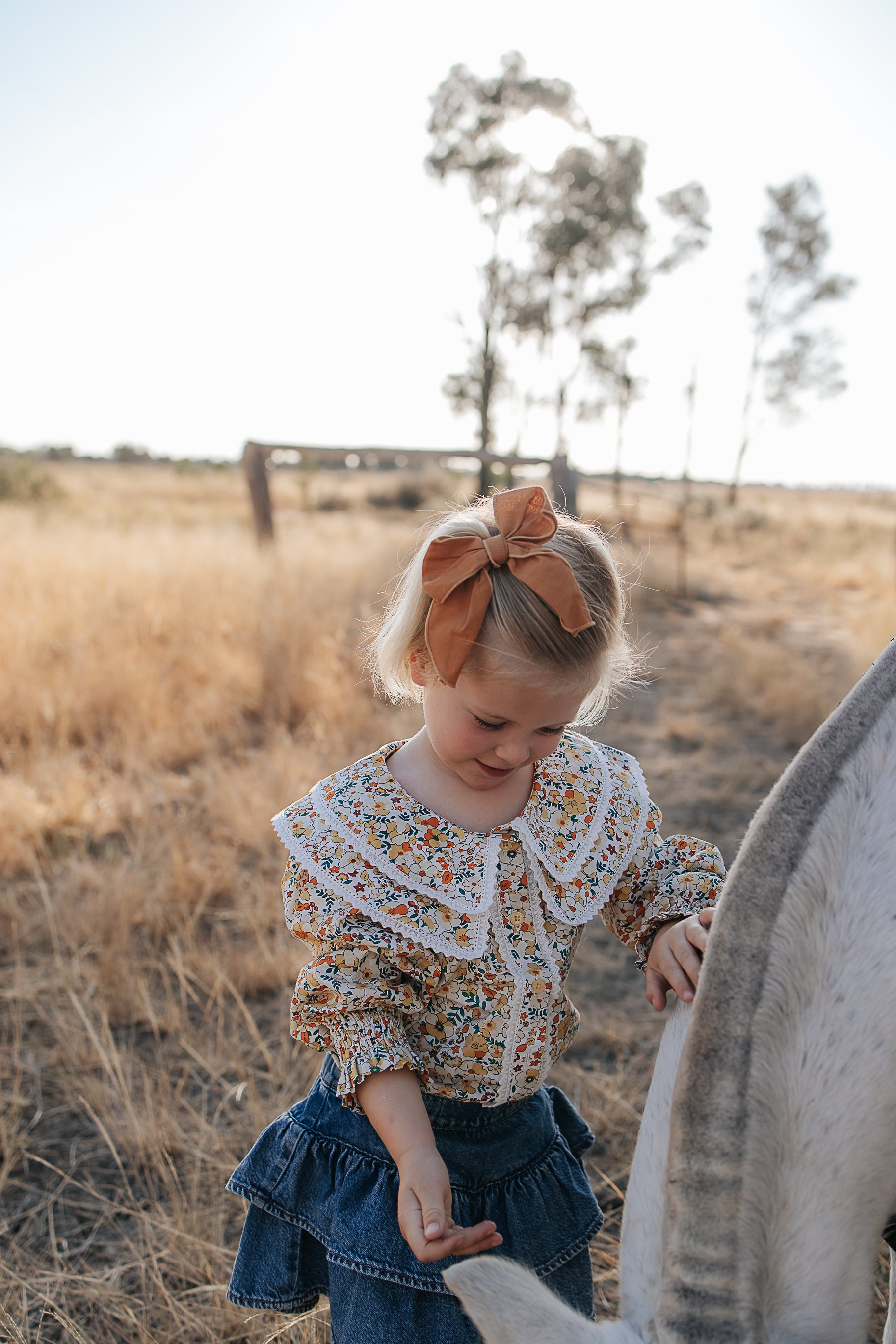 Elsie girls butter yellow floral long sleeve blouse worn by girl showing charming yellow floral country style