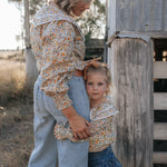 Britt yellow floral women's shirt flatlay showing full yellow floral shirt design