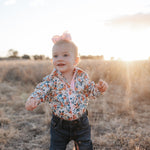 Milla floral dream long sleeve romper front view showing pretty floral print romper for toddlers