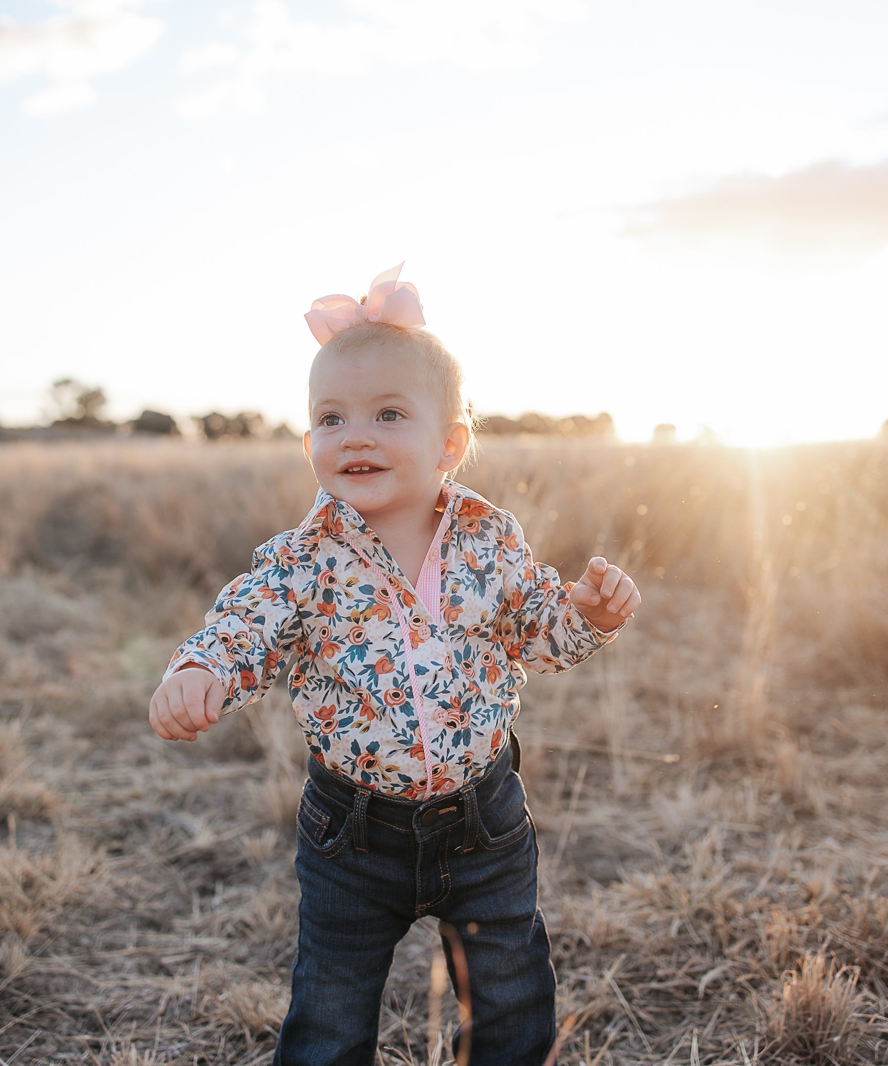 Milla floral dream long sleeve romper front view showing pretty floral print romper for toddlers