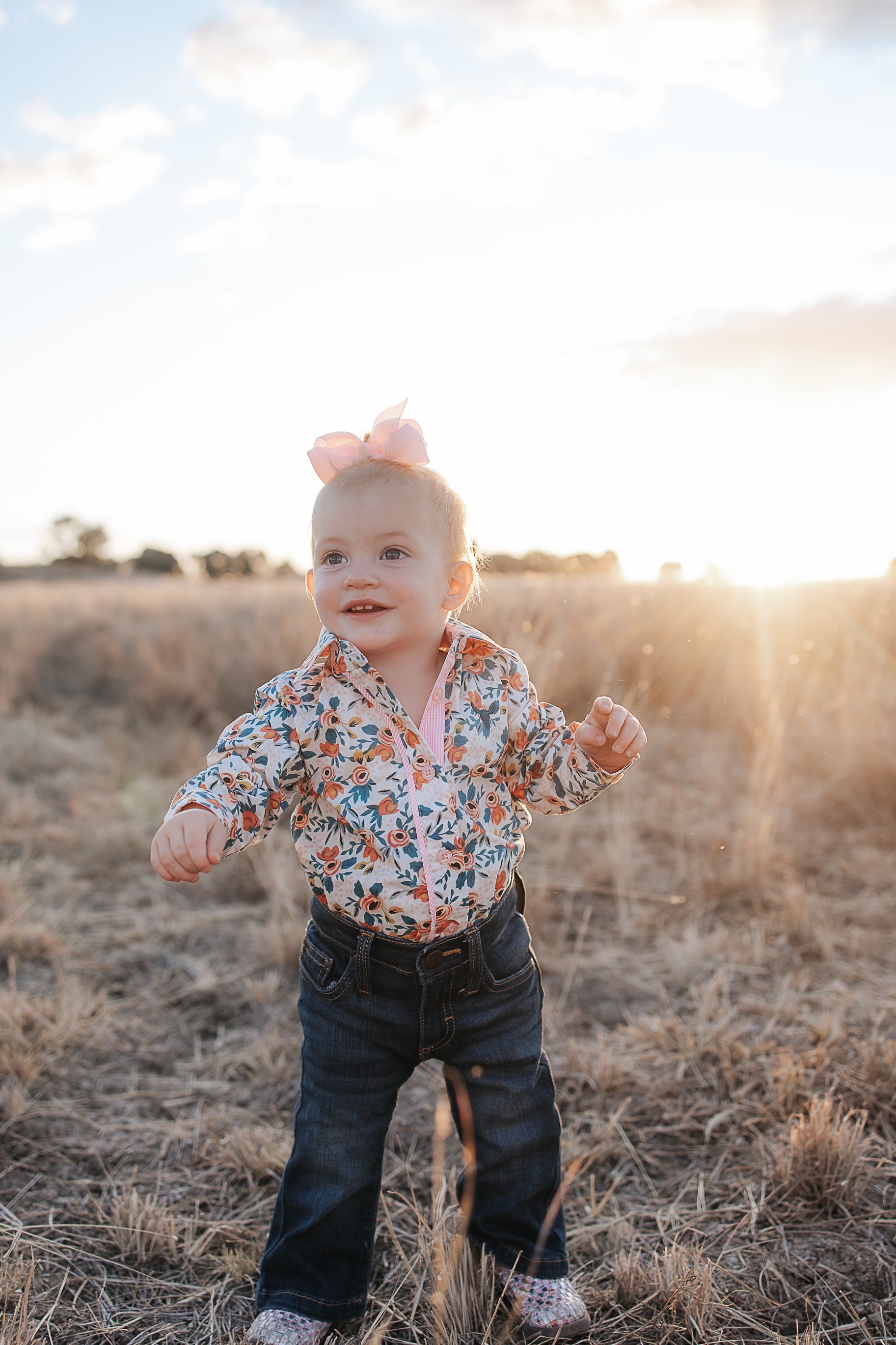 Milla floral dream long sleeve romper front view showing pretty floral print romper for toddlers