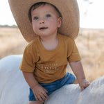 LWCC embroidered kids tee mustard flatlay showing full design and vibrant mustard colourway