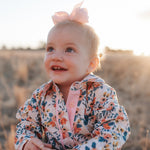 Milla floral dream long sleeve romper print close-up showing detailed floral dream pattern