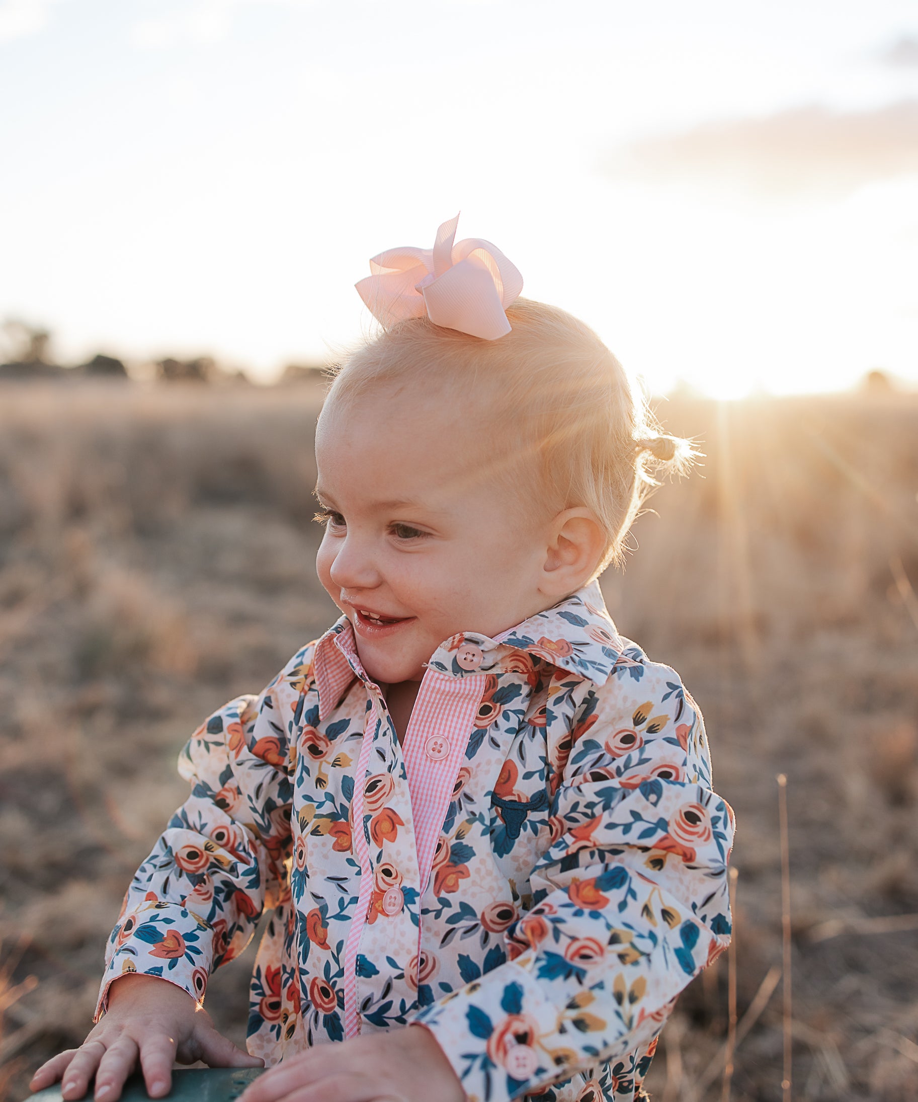 Milla floral dream long sleeve romper back view showing snap closure and beautiful floral dream print