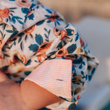 Milla floral dream long sleeve romper snap detail showing quality press stud closure