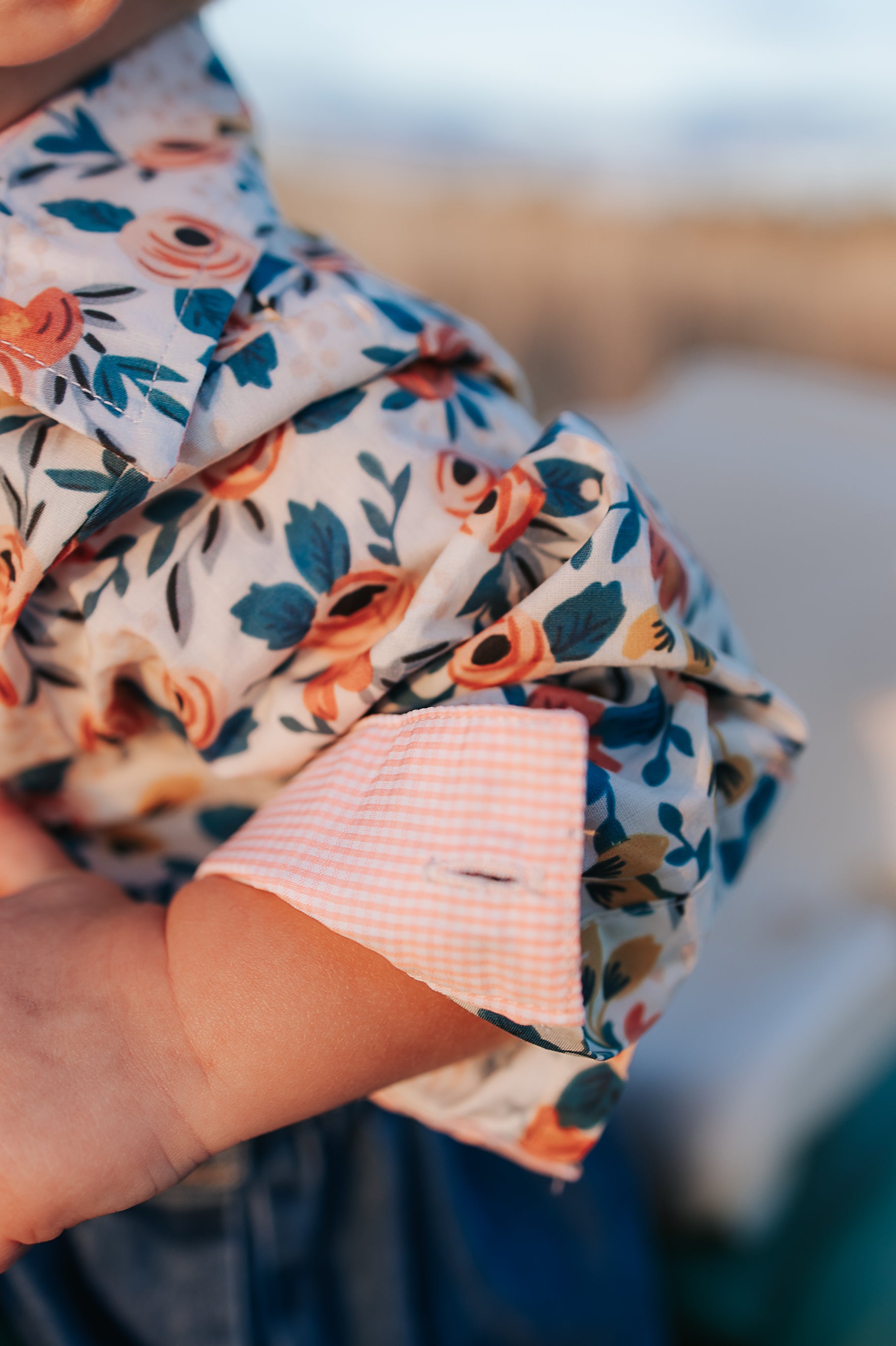 Milla floral dream long sleeve romper snap detail showing quality press stud closure