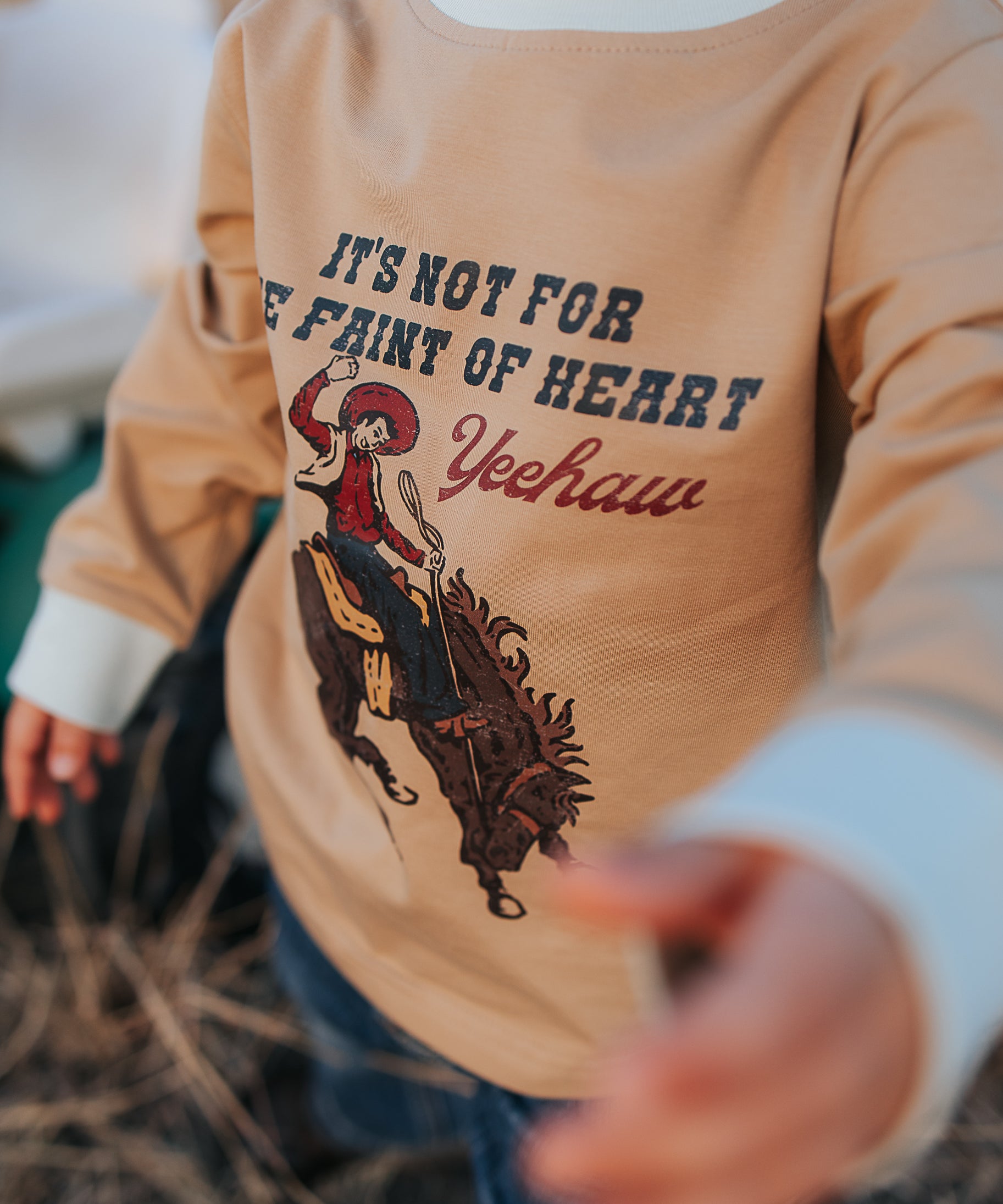 Nash Ride Hard tan long sleeve tee back view showing relaxed fit in tan with graphic print