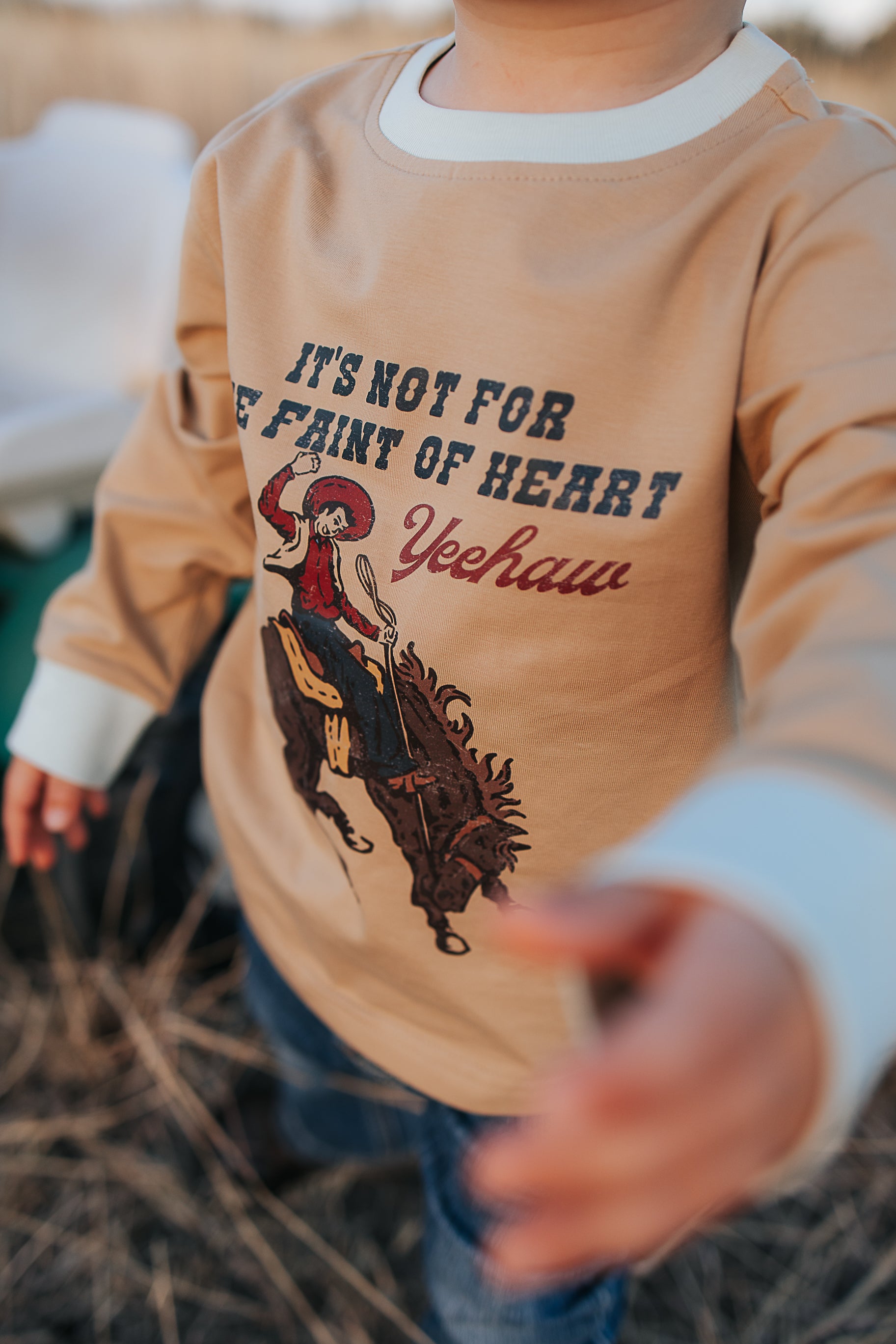 Nash Ride Hard tan long sleeve tee back view showing relaxed fit in tan with graphic print