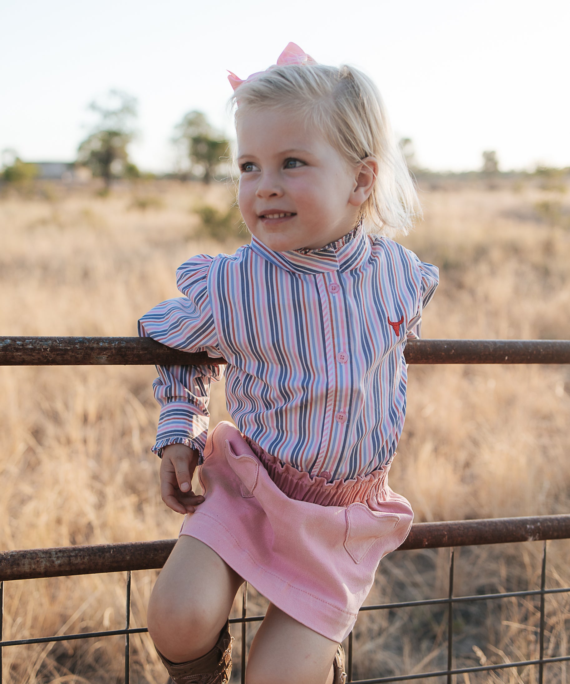 Lauren multi stripe pink ruffle long sleeve shirt front view showing pretty pink stripe shirt with ruffle detail