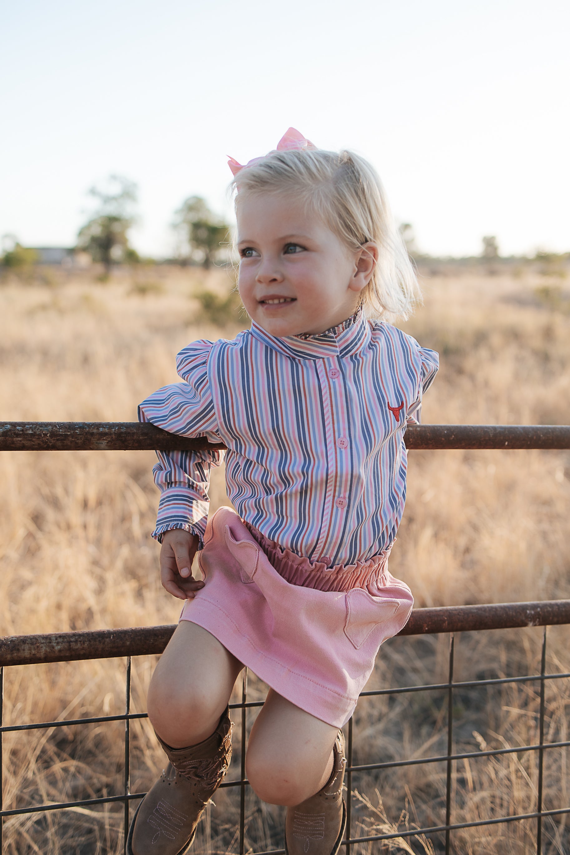 Lauren multi stripe pink ruffle long sleeve shirt front view showing pretty pink stripe shirt with ruffle detail