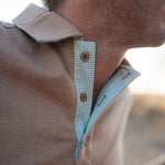 Clay Guy dust brown men's polo shirt back view showing relaxed men's fit in dust brown