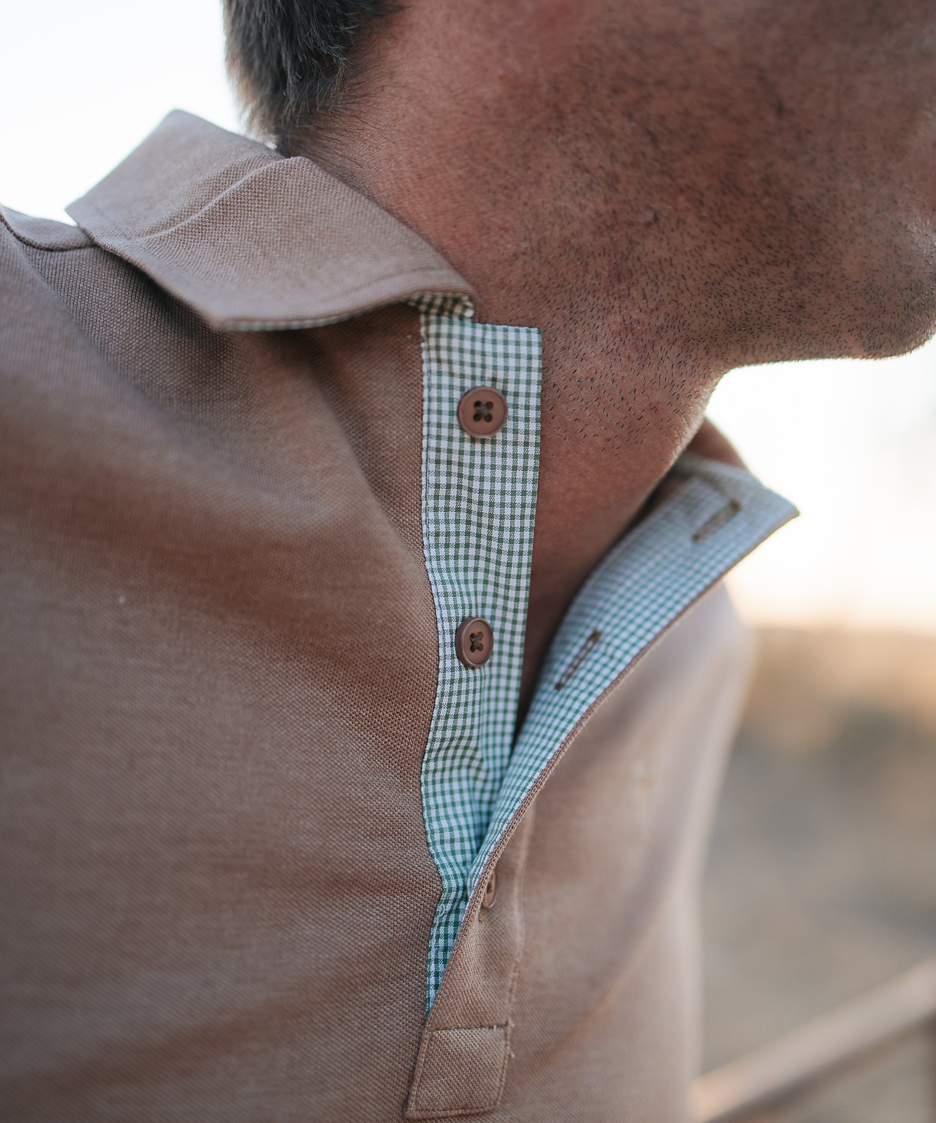 Clay Guy dust brown men's polo shirt back view showing relaxed men's fit in dust brown