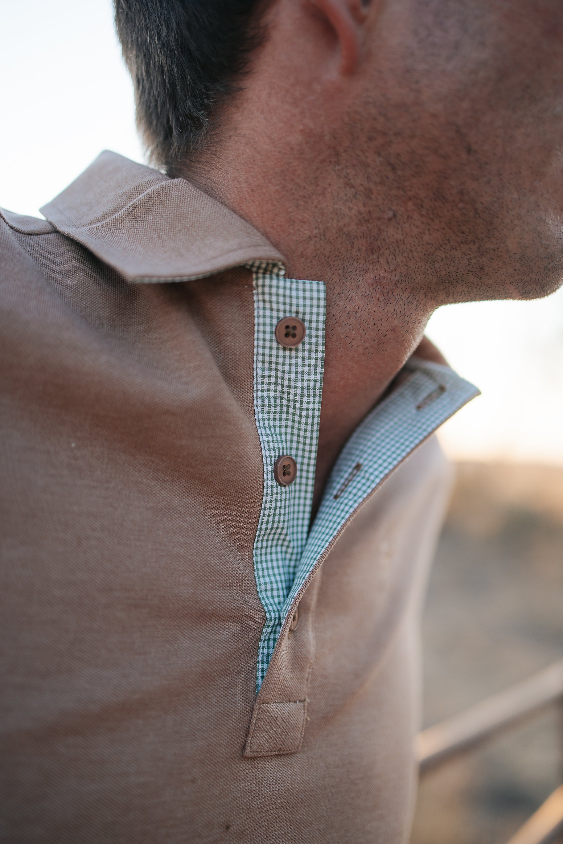 Clay Guy dust brown men's polo shirt back view showing relaxed men's fit in dust brown
