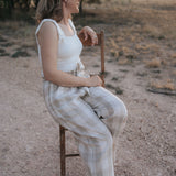 Latte Luci ladies linen pants side view showing relaxed wide leg silhouette in latte linen
