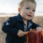 Brad Baby navy contrast long gingham baby polo romper front view showing classic navy gingham baby boy romper
