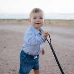 Rhett multi stripe blue long sleeve romper worn showing vibrant multi stripe blue country style