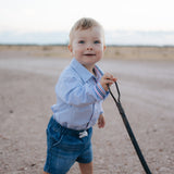 Rhett multi stripe blue long sleeve romper worn showing vibrant multi stripe blue country style