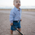 Rhett multi stripe blue long sleeve romper front view showing bold multi stripe blue romper for kids