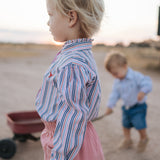 Lauren multi stripe pink ruffle long sleeve shirt worn showing feminine western country women's style