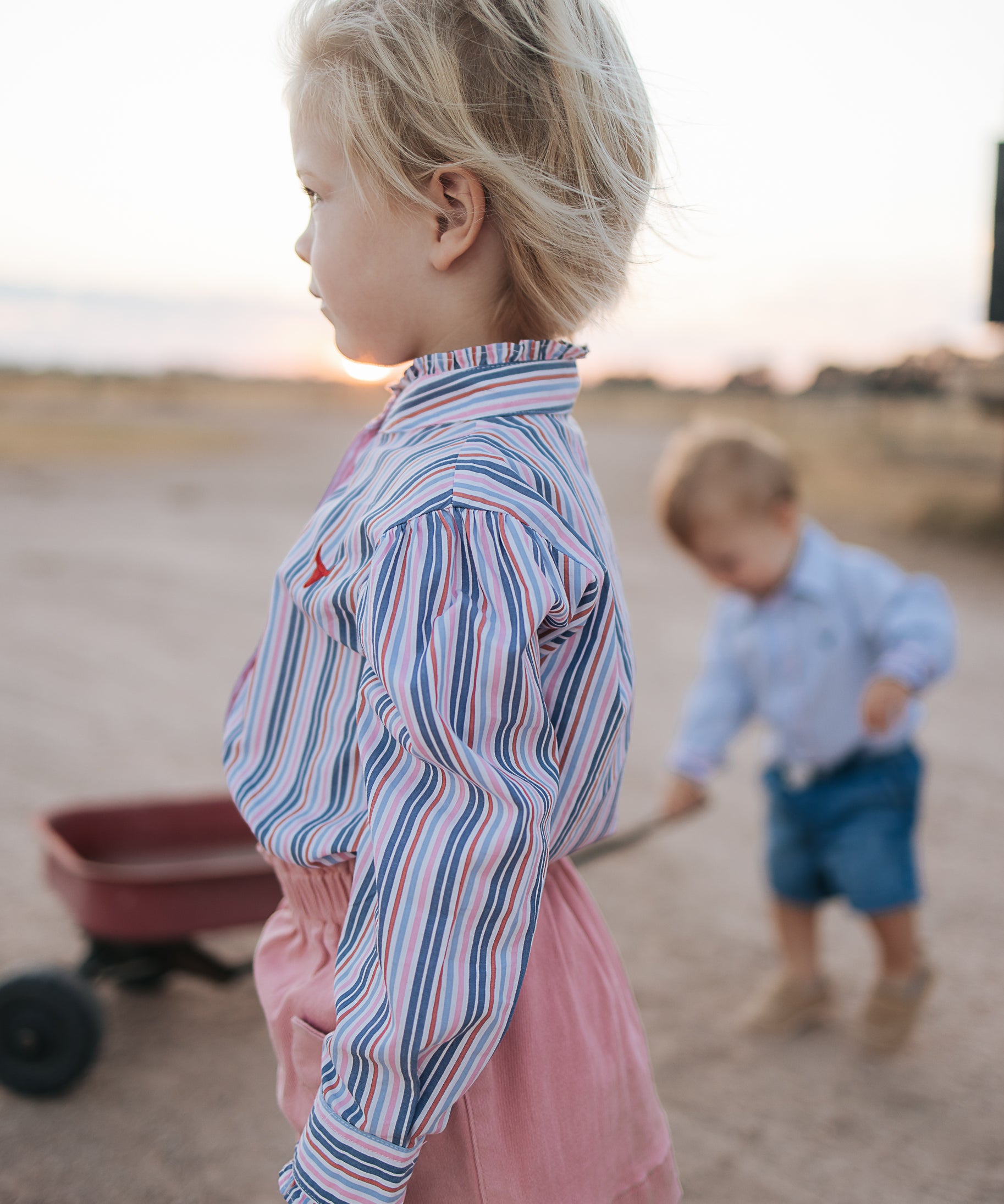 Lauren multi stripe pink ruffle long sleeve shirt worn showing feminine western country women's style