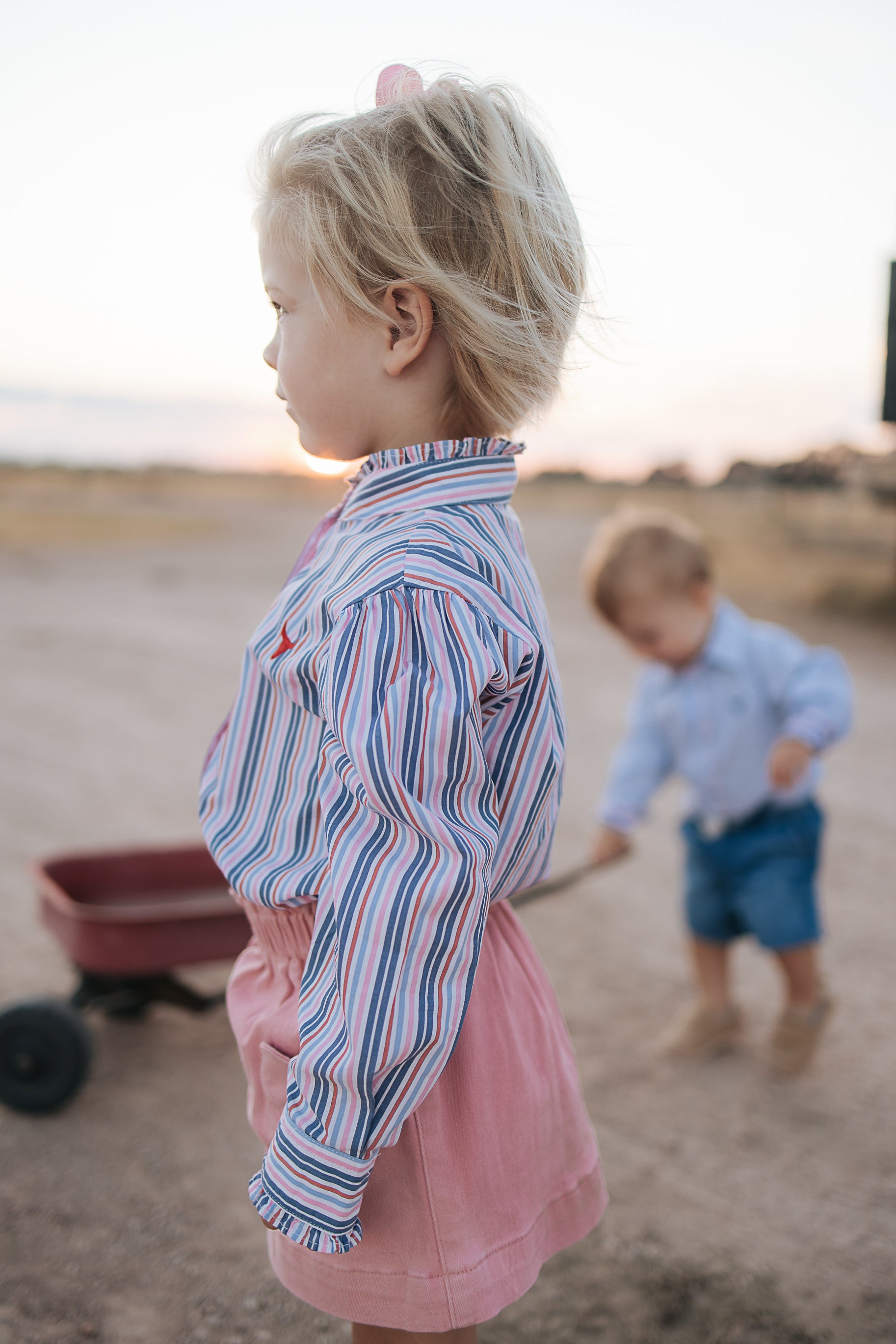 Lauren multi stripe pink ruffle long sleeve shirt worn showing feminine western country women's style