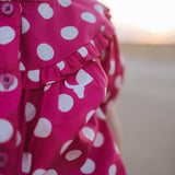 Kansas polkadot pink short sleeve blouse worn by girl showing sweet playful pink polkadot style