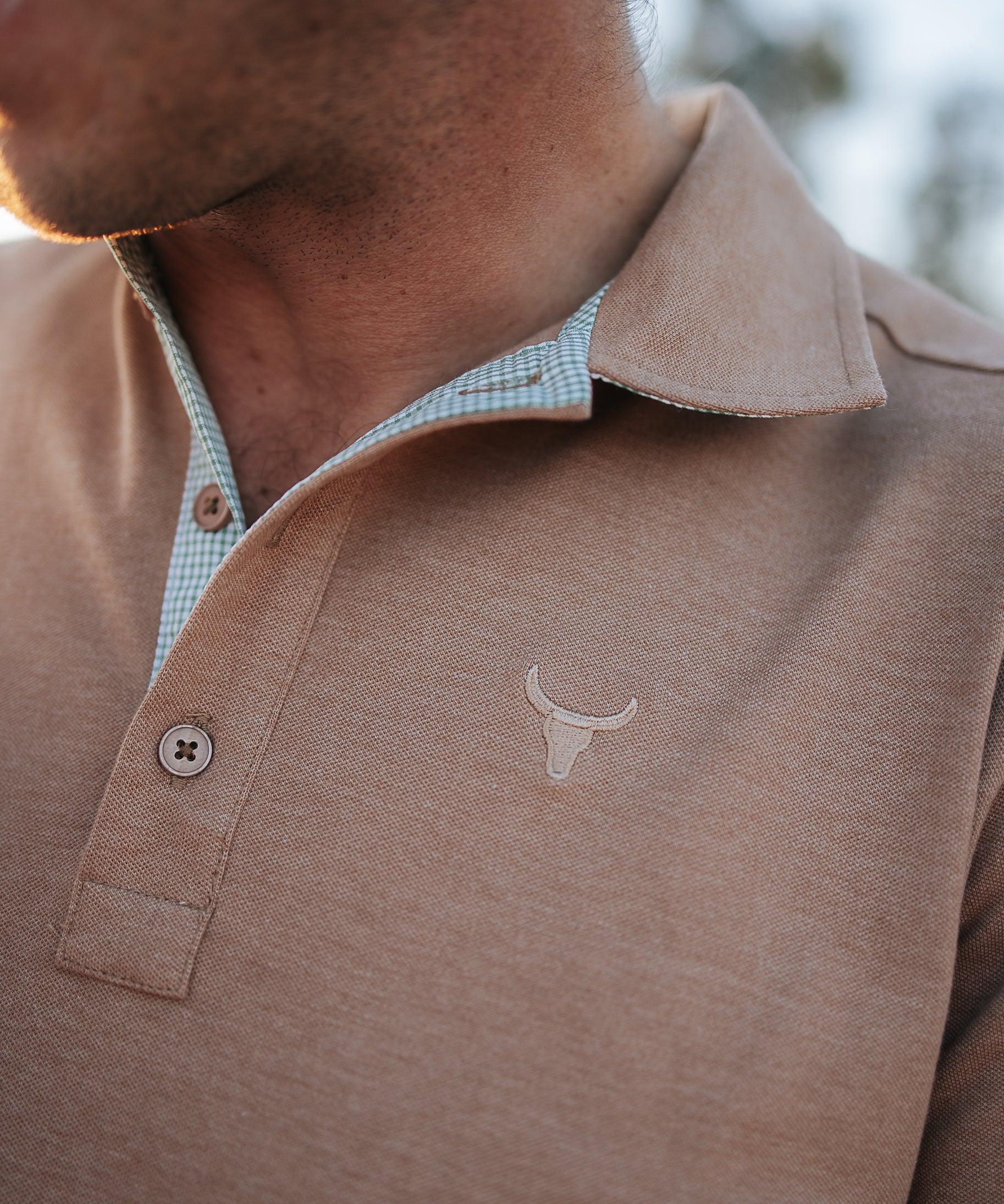 Clay Guy dust brown men's polo shirt worn showing smart casual dust brown country style