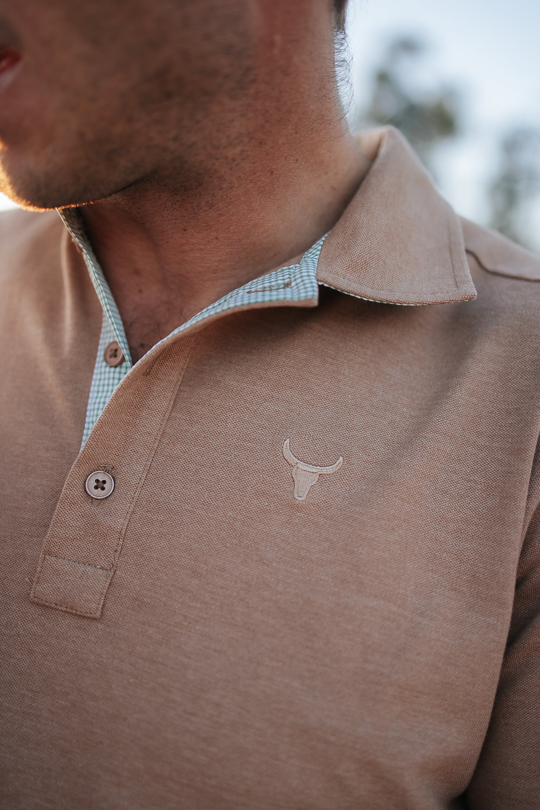 Clay Guy dust brown men's polo shirt worn showing smart casual dust brown country style