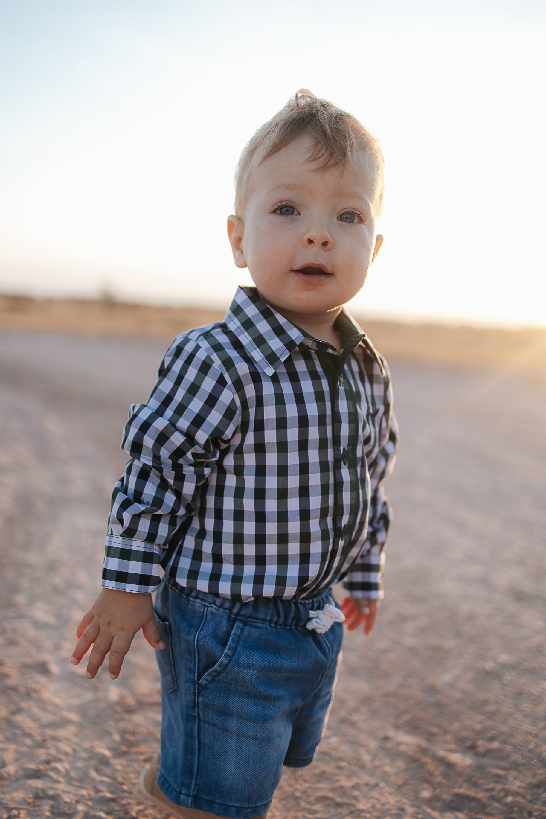 Cody green and navy gingham long sleeve romper back view showing snap closure and gingham check