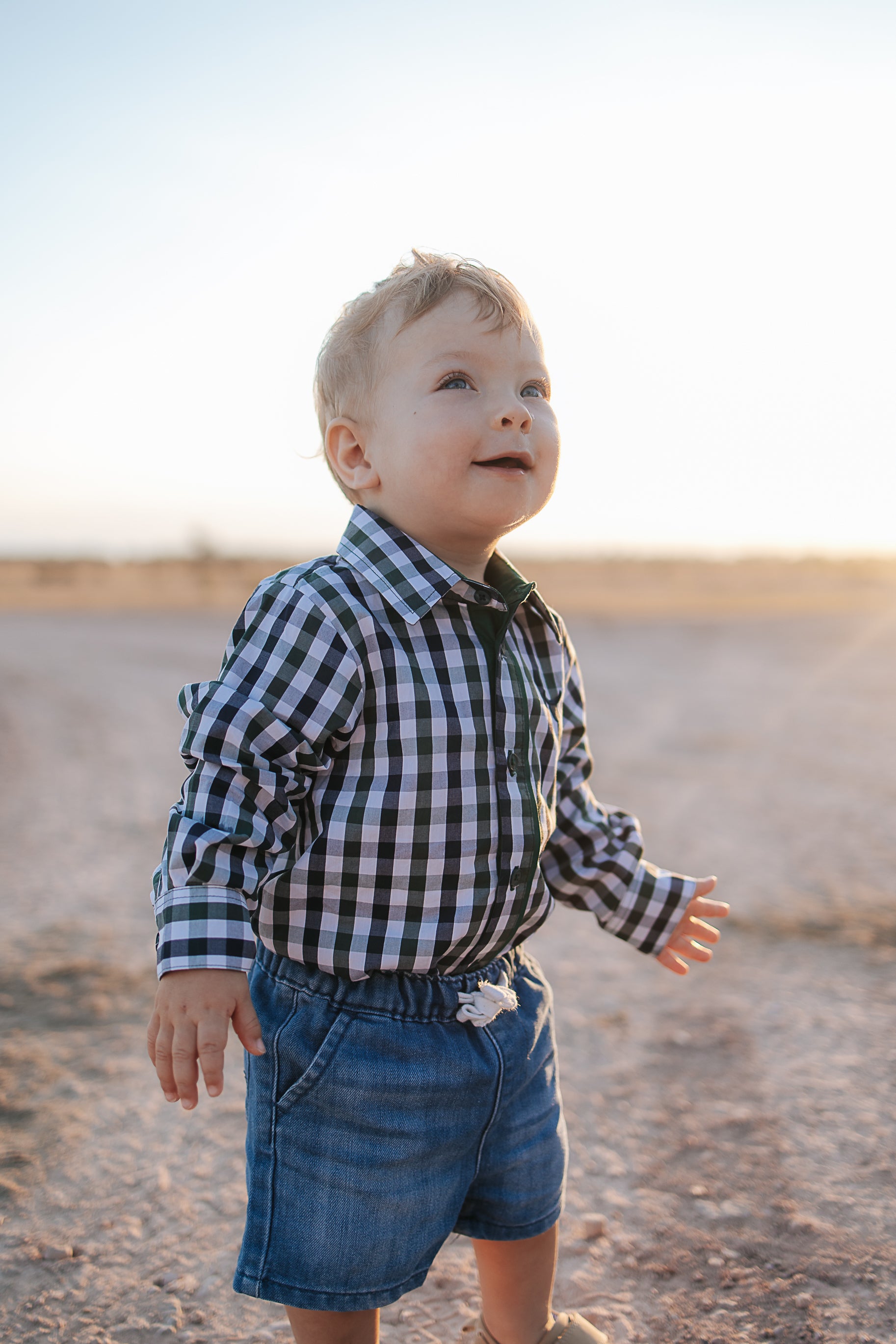 Cody green and navy gingham long sleeve romper flatlay showing full green navy check design
