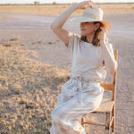Latte Luci ladies linen pants back view showing relaxed wide leg silhouette and warm latte linen