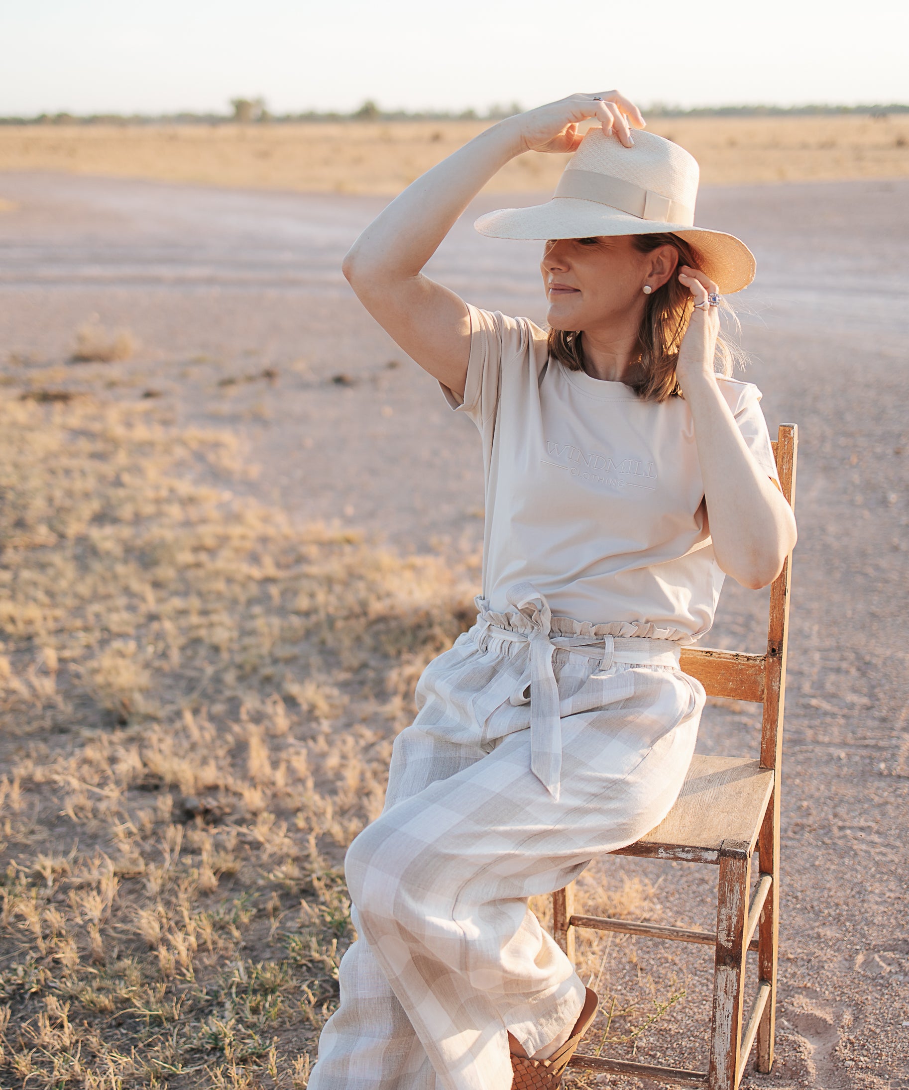 Latte Luci ladies linen pants back view showing relaxed wide leg silhouette and warm latte linen