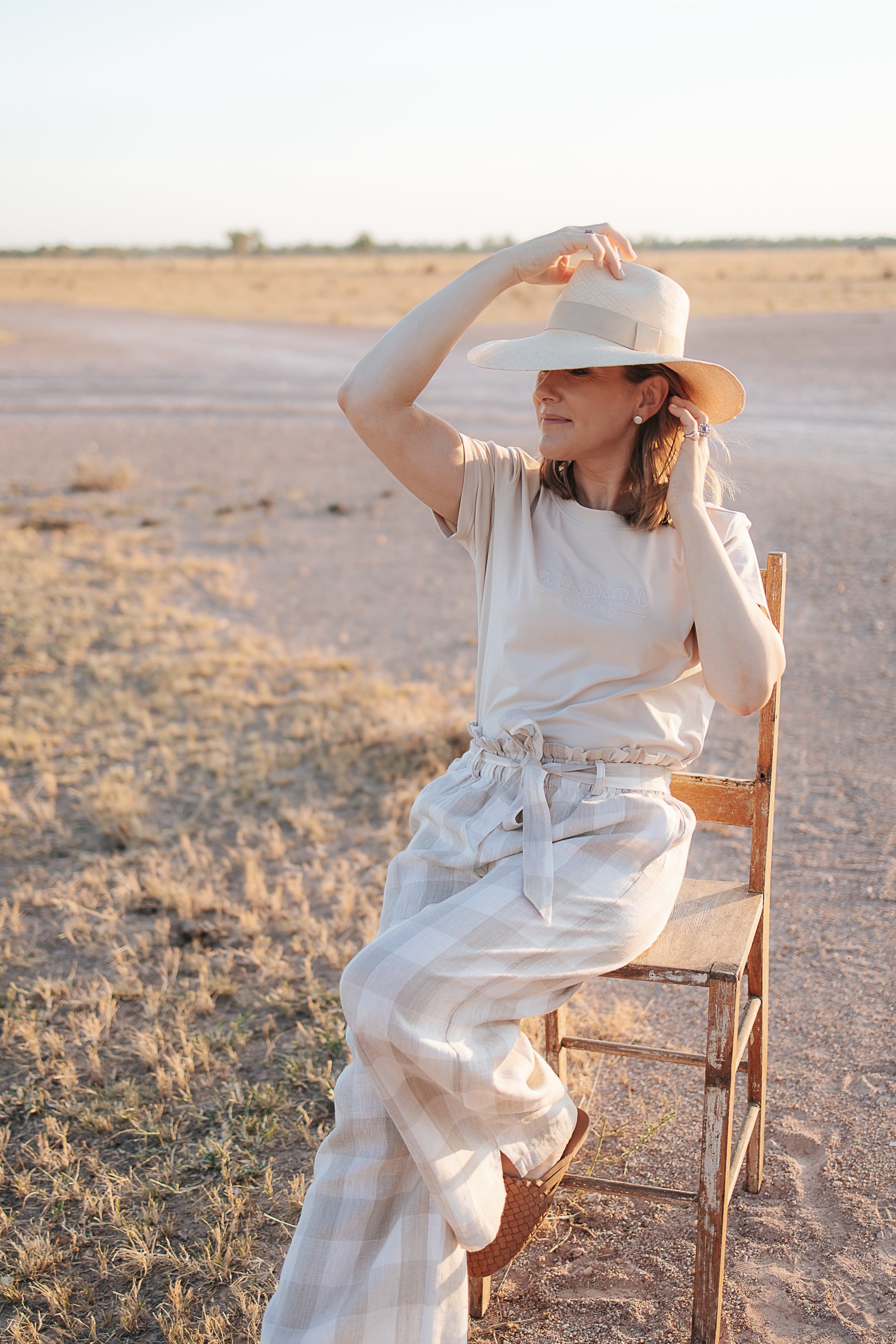 Latte Luci ladies linen pants back view showing relaxed wide leg silhouette and warm latte linen