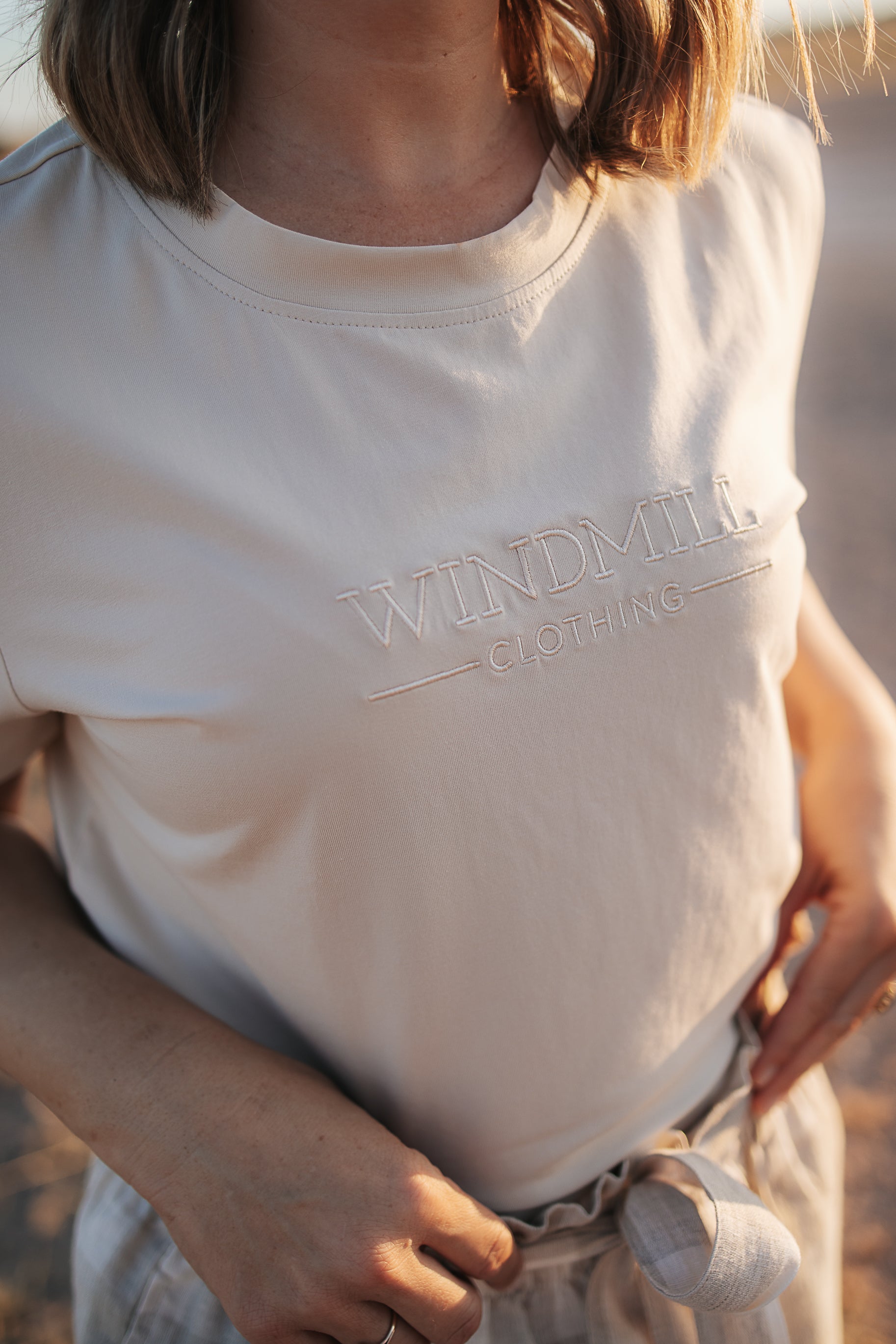 LWCC embroidered ladies tee beige back view showing relaxed women's fit and timeless beige