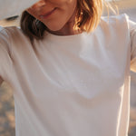 LWCC embroidered ladies tee beige front view showing signature LWCC embroidered logo on classic beige