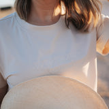 LWCC embroidered ladies tee beige embroidery close-up showing detailed LWCC logo stitch on beige