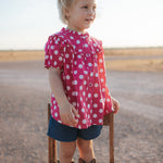 Kansas polkadot pink short sleeve blouse front view showing cute pink polkadot blouse for girls