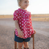 Kansas polkadot pink short sleeve blouse front view showing cute pink polkadot blouse for girls