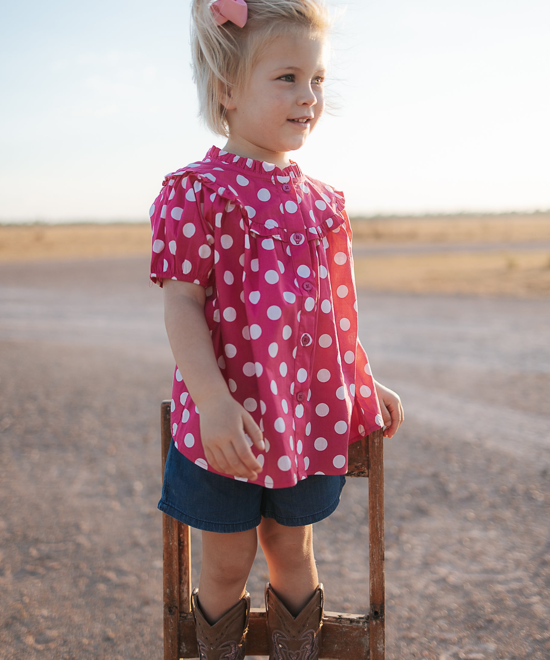 Kansas polkadot pink short sleeve blouse front view showing cute pink polkadot blouse for girls