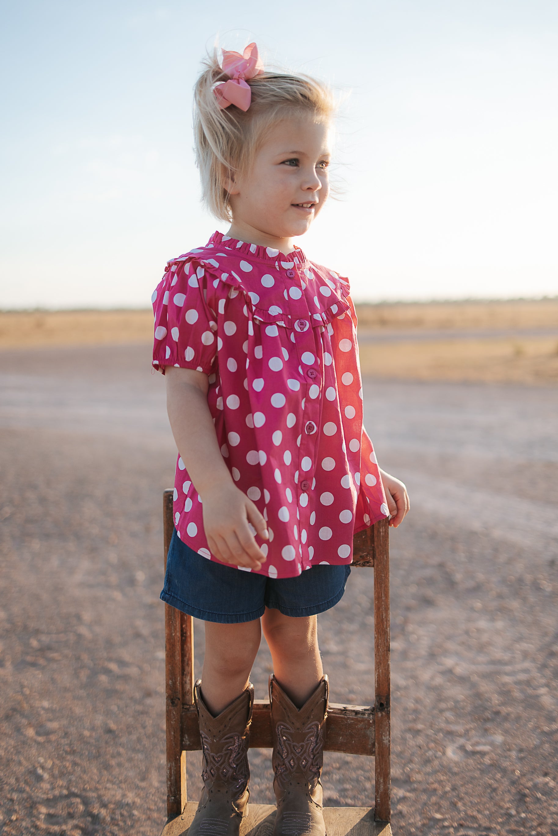Kansas polkadot pink short sleeve blouse front view showing cute pink polkadot blouse for girls
