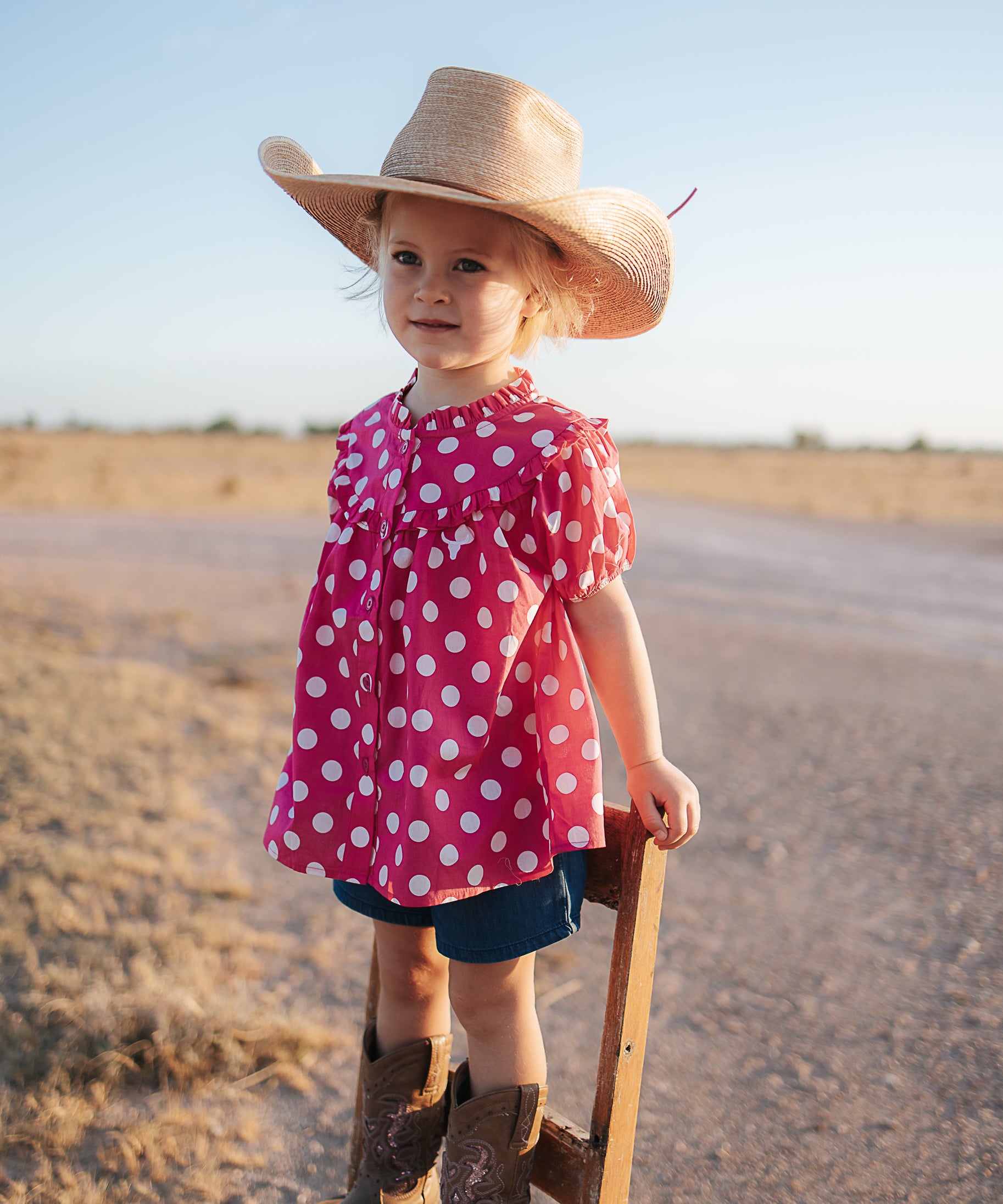 Kansas polkadot pink short sleeve blouse back view showing relaxed girls fit in pink polkadot