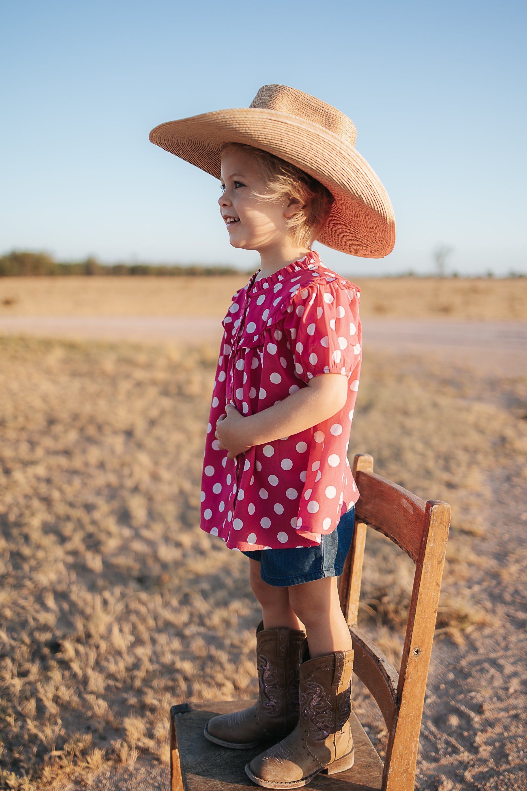 Kansas polkadot pink short sleeve blouse flatlay showing full pink polkadot blouse design