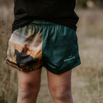Moss green footy shorts side view showing comfortable cut and moss green colourway