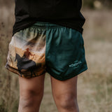Moss green footy shorts side view showing comfortable cut and moss green colourway