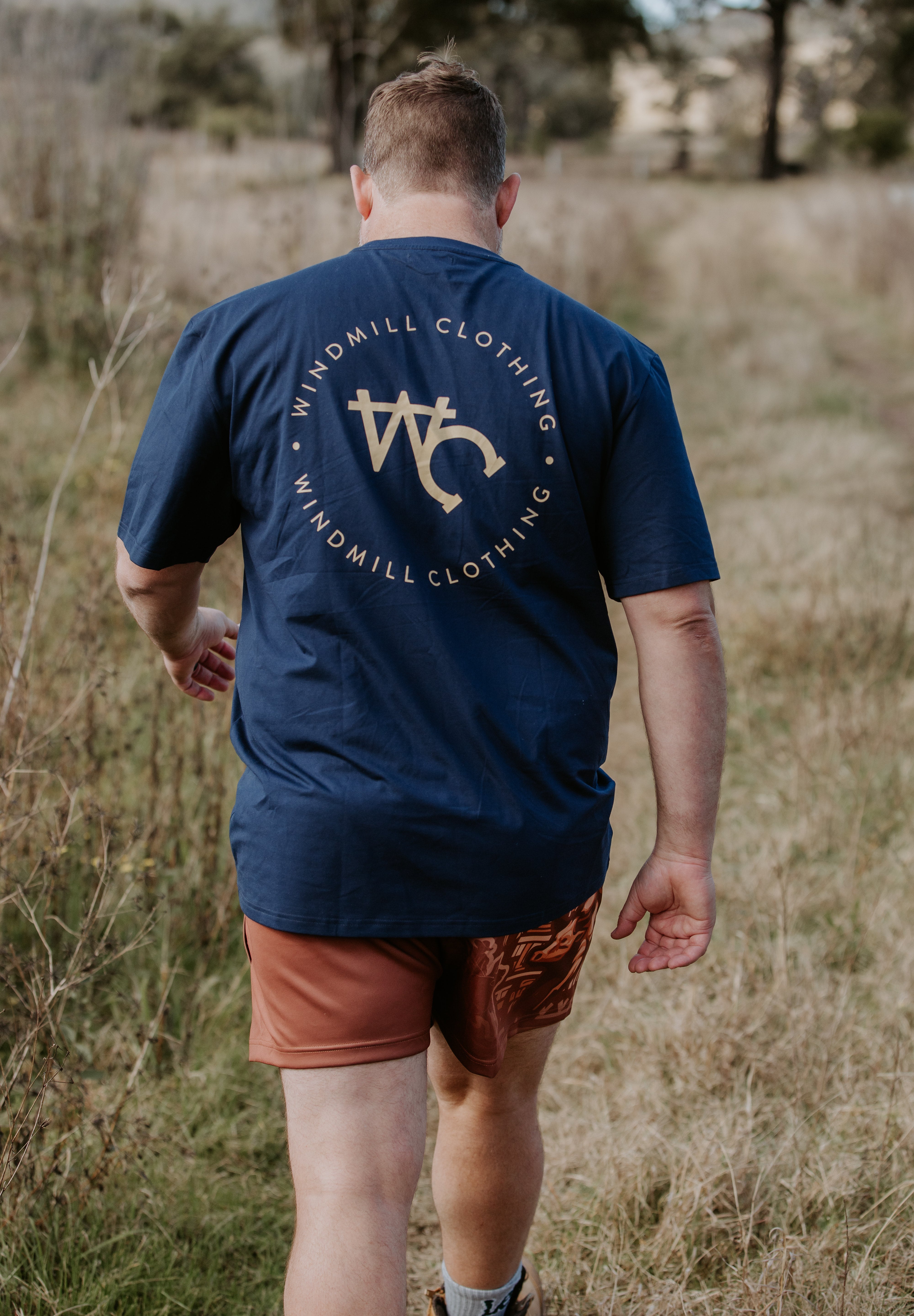Dust scene bull men's footy shorts flat lay showing full dust and bull graphic design