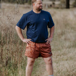 Dust scene bull men's footy shorts front view showing striking bull dust scene graphic print