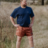 Dust scene bull men's footy shorts front view showing striking bull dust scene graphic print