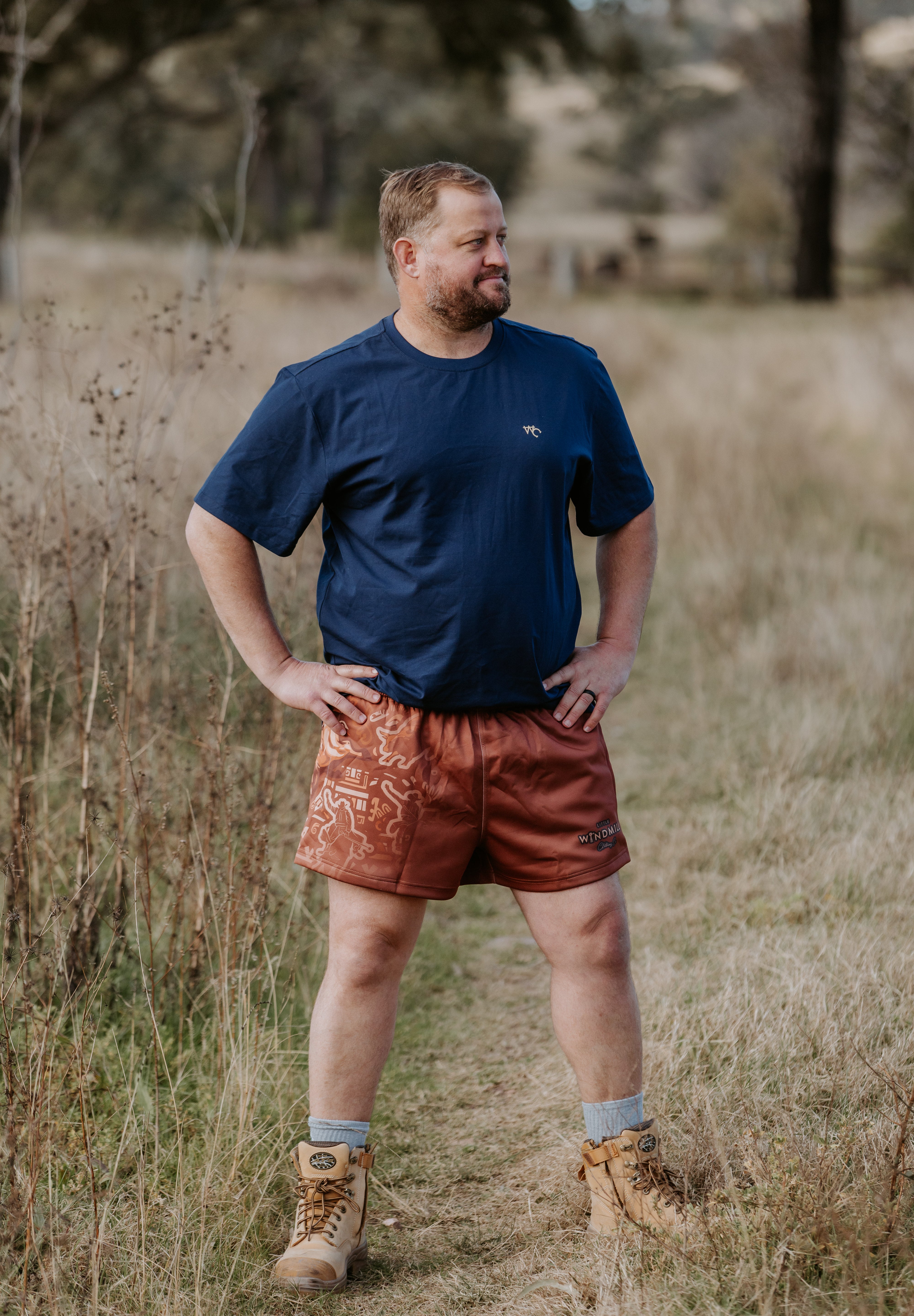 Dust scene bull men's footy shorts front view showing striking bull dust scene graphic print
